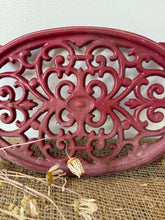 Load image into Gallery viewer, Vintage Cast Iron Pinky Red Trivet
